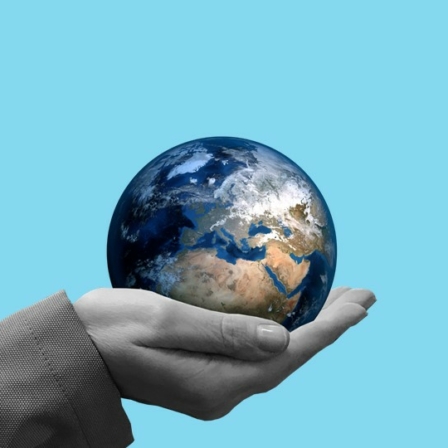 The globe on the palm of a hand.